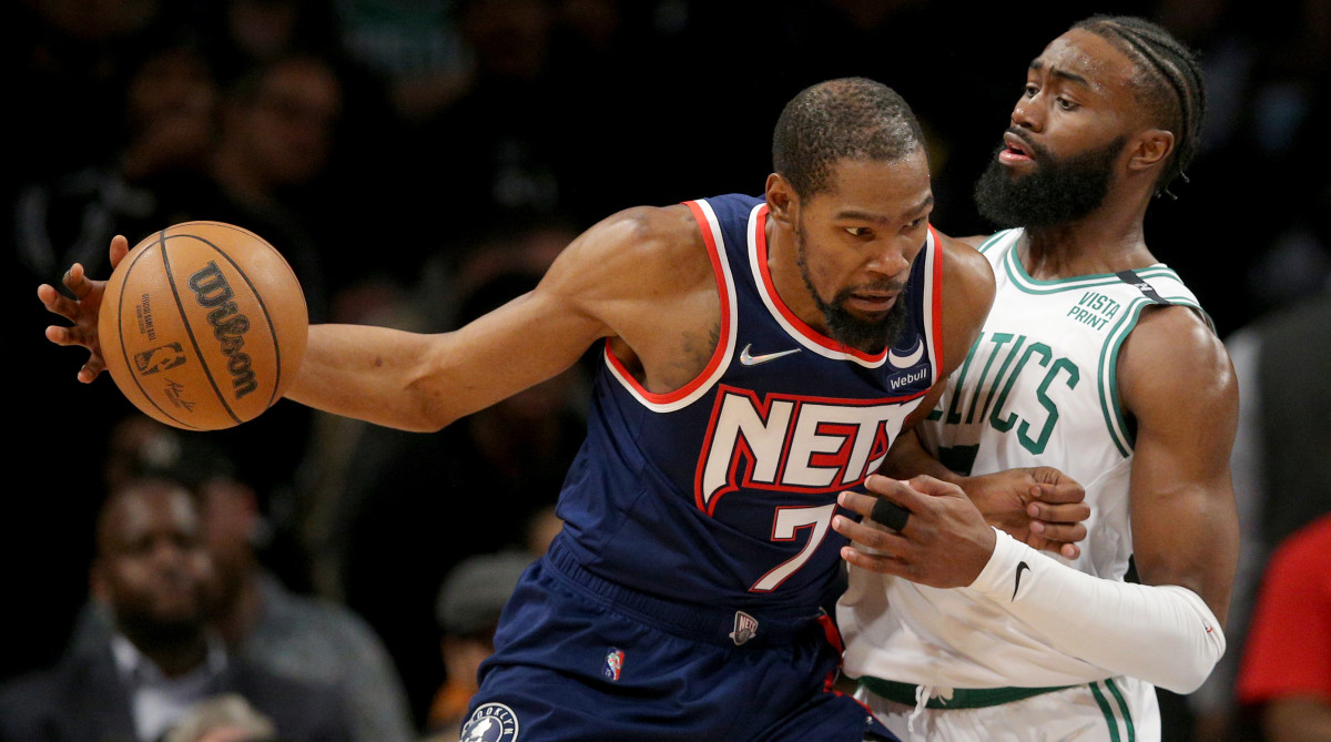 Nets forward Kevin Durant works in the post on Celtics wing Jaylen Brown.
